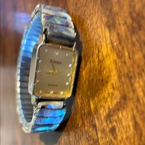 Sleek Silver and Blue Jewelry Watch with Iridescent Band